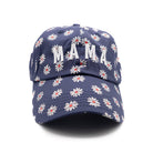 Navy blue cap with white floral pattern and 'MAMA' text on a white background