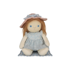 Stuffed doll with red hair, blue dress, and pink hat on a white background