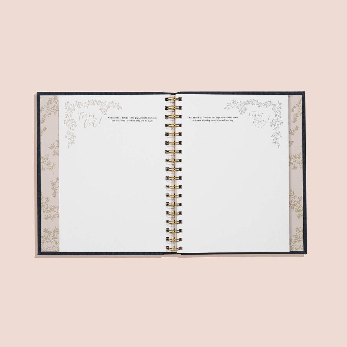 Open planner with decorative inner cover on a light pink background