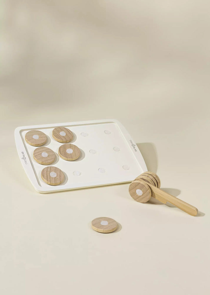 Set of wooden honey dipper and honeycomb slices on a beige background