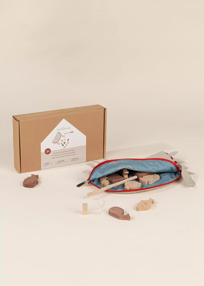 Wooden toy set with tools and heart-shaped blocks on a beige background
