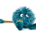 Blue plush toy with googly eyes on a white background