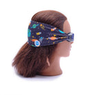 Mannequin head wearing a space-themed headband on a white background