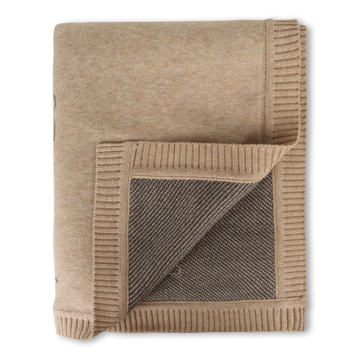 Folded beige blanket with textured corner on a white background
