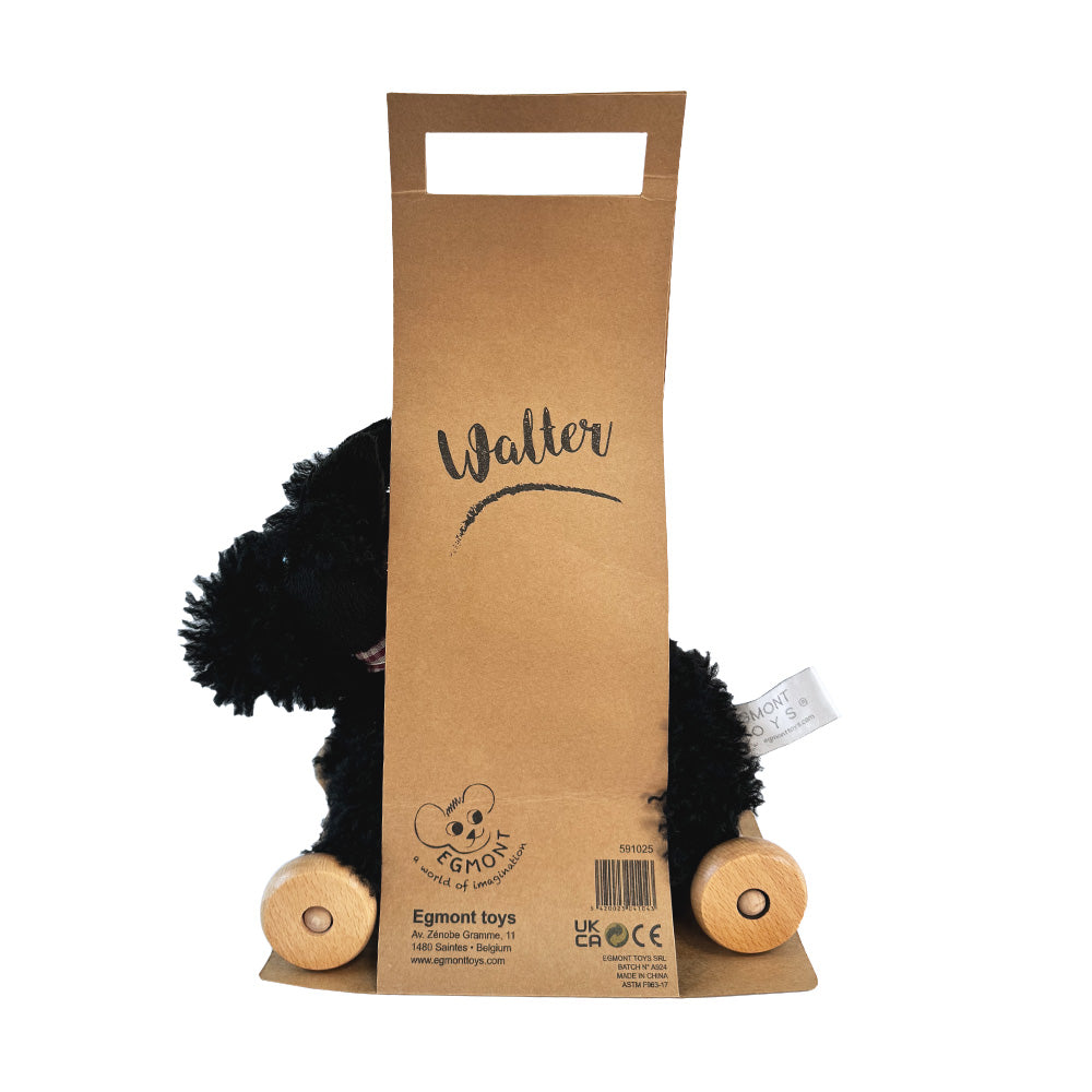 Black plush toy with wooden feet peeking out from a brown cardboard packaging labeled 'Walter' by Egmont Toys.