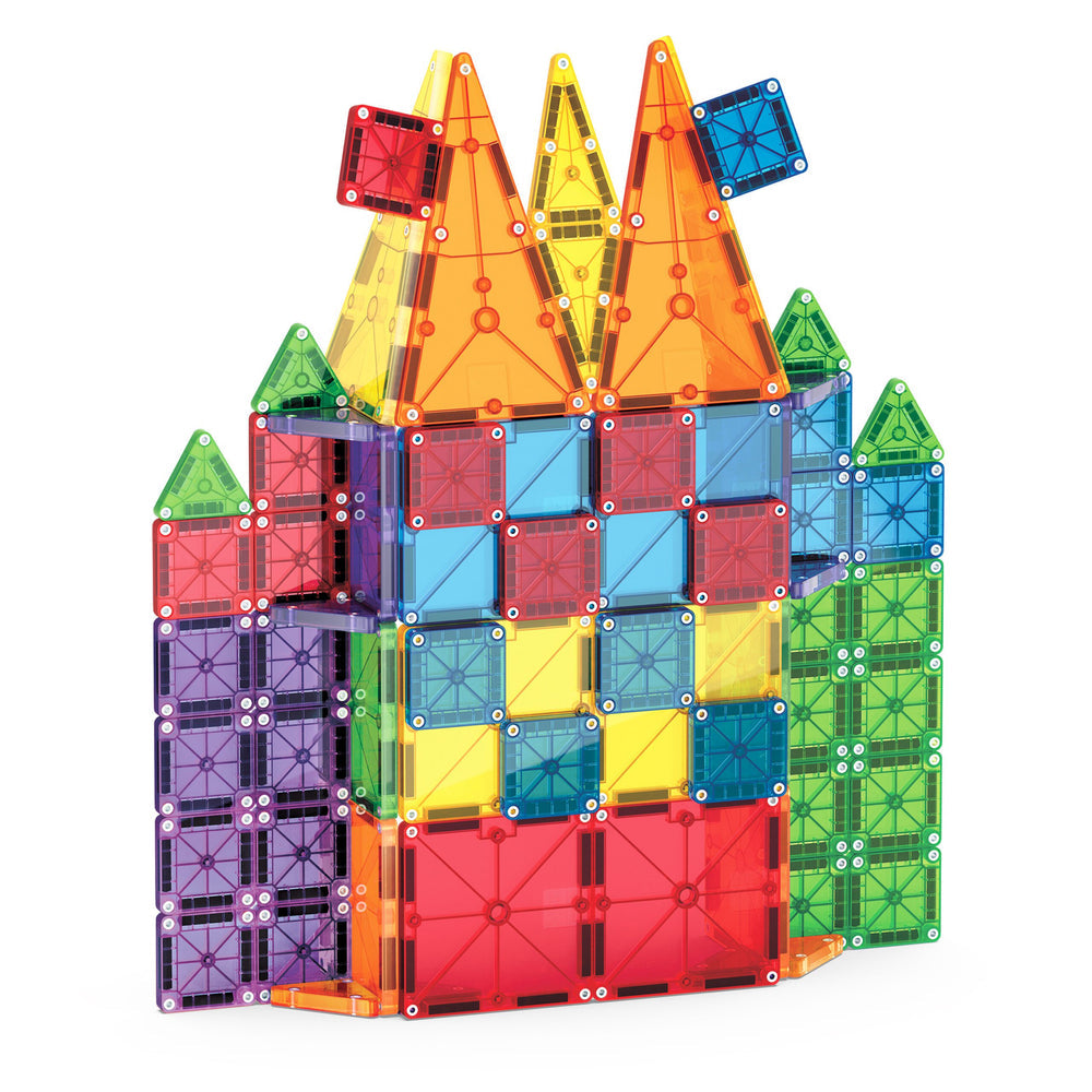 An assembled colorful 3D castle or tower structure built from translucent standard-sized and micro-sized magnetic geometric tiles, set against a plain white background.