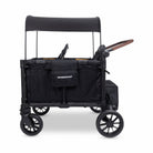 Black WonderFold stroller wagon with canopy on a white background