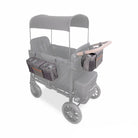Gray stroller wagon with storage bags and canopy on a white background