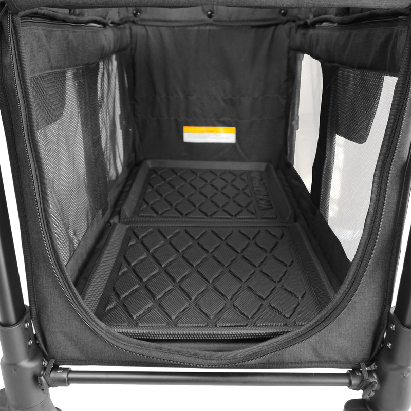 Black pet crate with textured floor and mesh sides on a white background