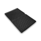 Black rubber mat with textured surface on a white background