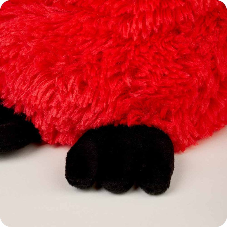 A close-up view of the Red Cardinal by Warmies plush toy, highlighting its bright red fuzzy fur and soft black feet.