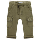 Green cargo pants with a drawstring on a white background