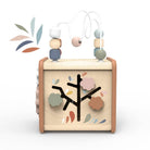 Wooden baby toy with beads and tree design on a white background