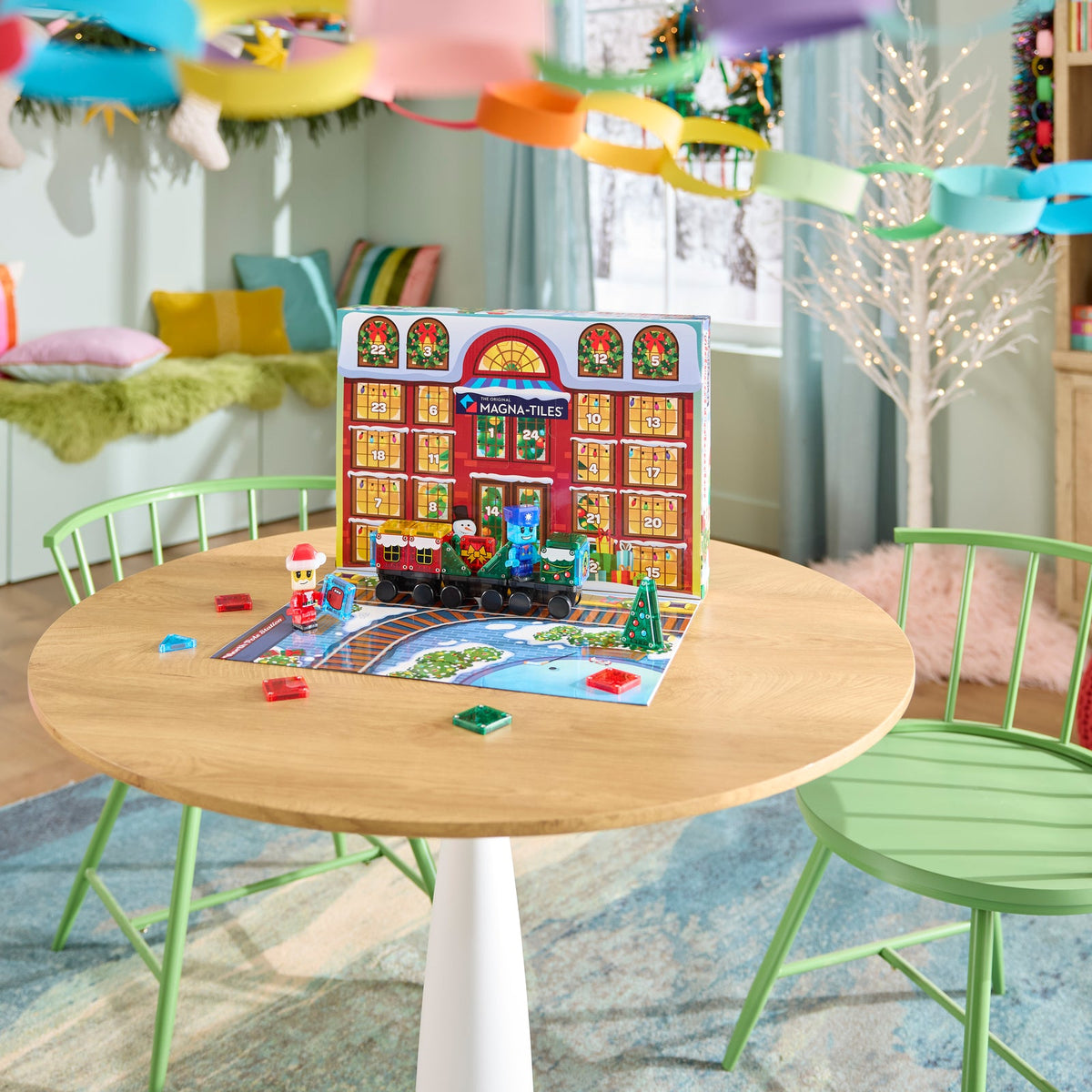 Children's play area with a wooden table, colorful chairs, and a toy set on the table.