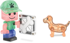 Toy figure with a transparent machine part and a small dog-like figure on a white background