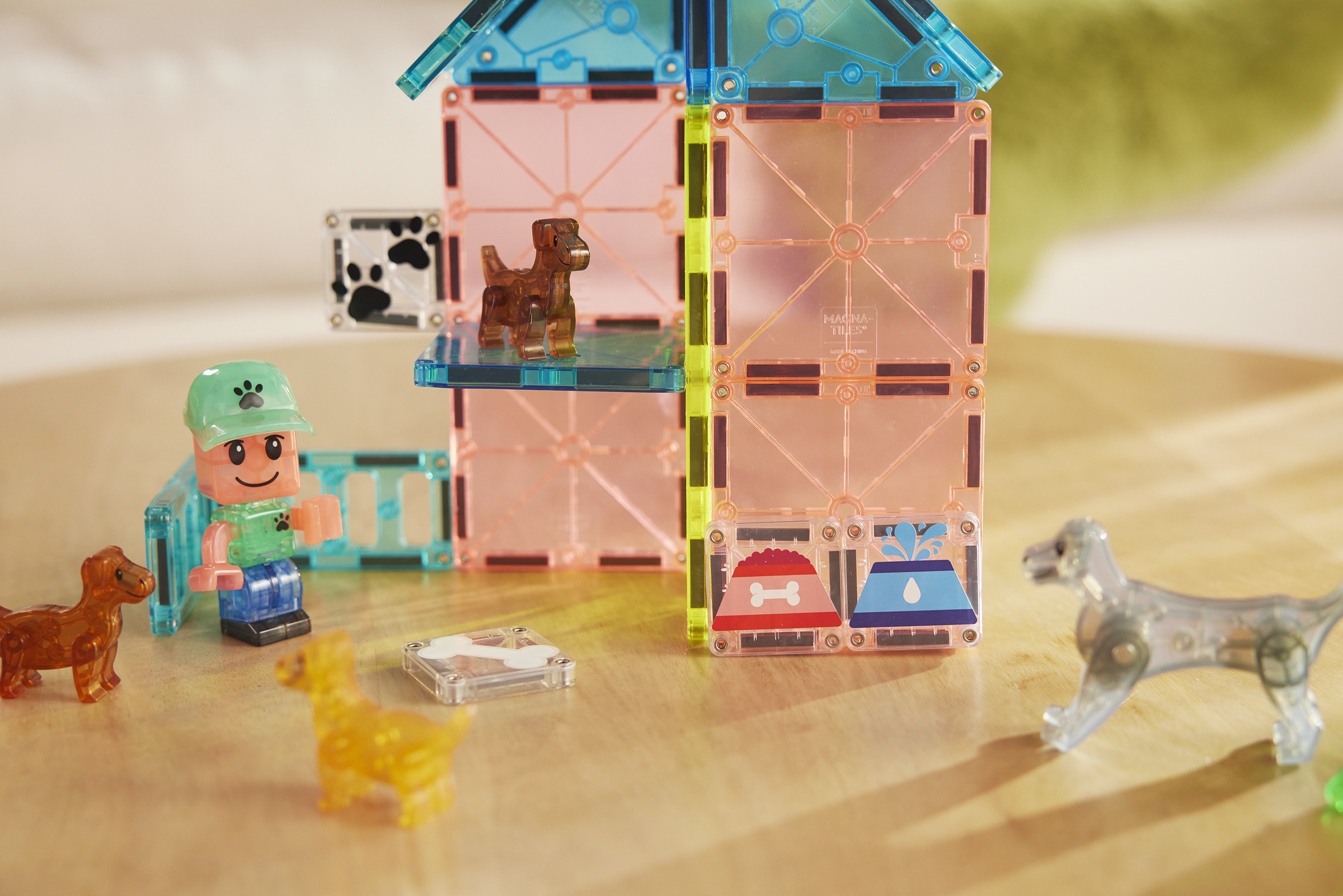 Toy figure with a transparent building block set on a wooden surface