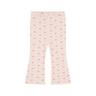 A pair of light pink flared leggings with an all-over print of small orange-brown teddy bears and tiny red hearts, shown flat against a solid white background.