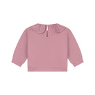 A dusty pink long-sleeve top for toddlers, featuring a ruffled Peter Pan collar shown against a plain white background.