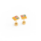 Gold cufflinks with colorful design on a white background