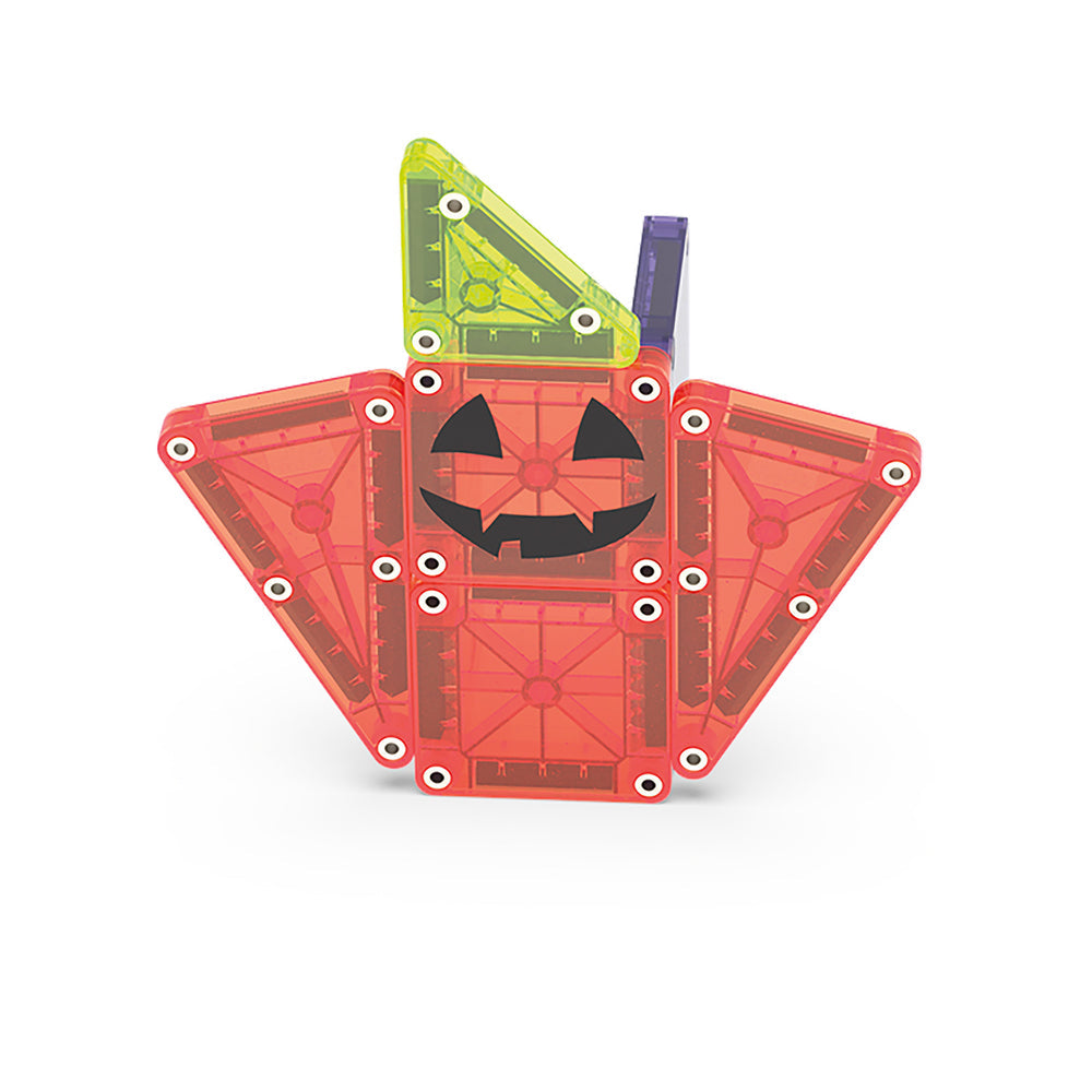 Pumpkin-shaped building set with a face on a white background