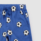Blue shorts with soccer ball pattern on a white background