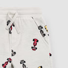 Light gray sweatpants with Formula 1 car pattern on a light gray background