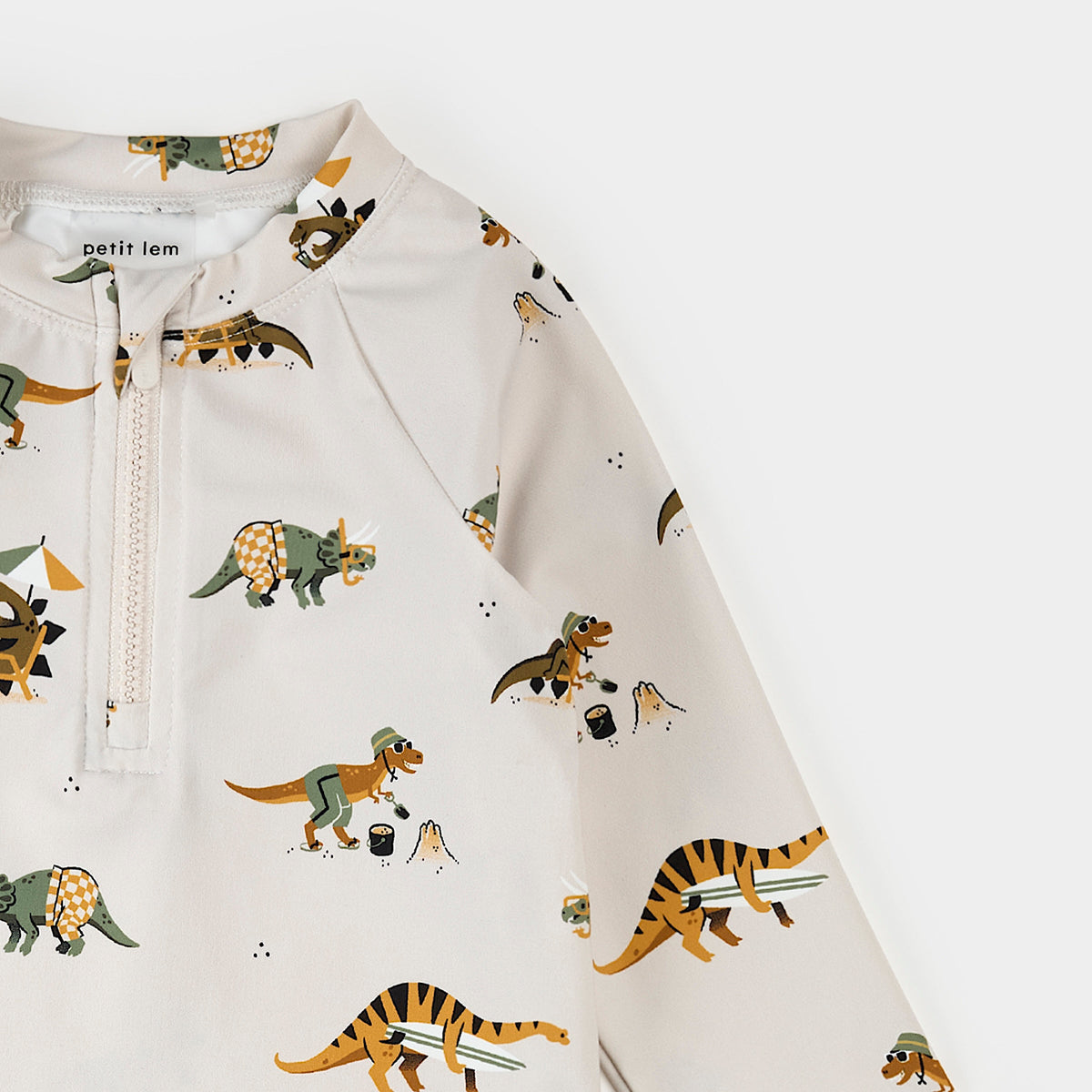 Children's hoodie with dinosaur pattern on a white background