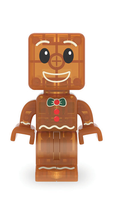 A gingerbread-themed toy minifigure with a square head, brown body, white icing details, and a green and red bow tie, centered on a plain white background.