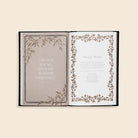 Open book with decorative pages and a quote on a beige background