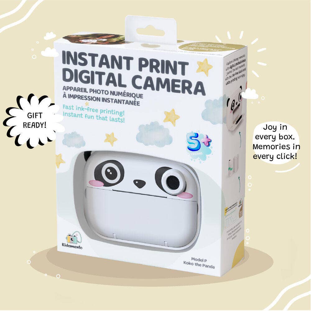 Boxed instant print digital camera with panda design on a beige background