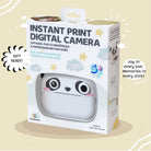 Boxed instant print digital camera with panda design on a beige background