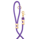 Purple rope with gold hardware on a white background