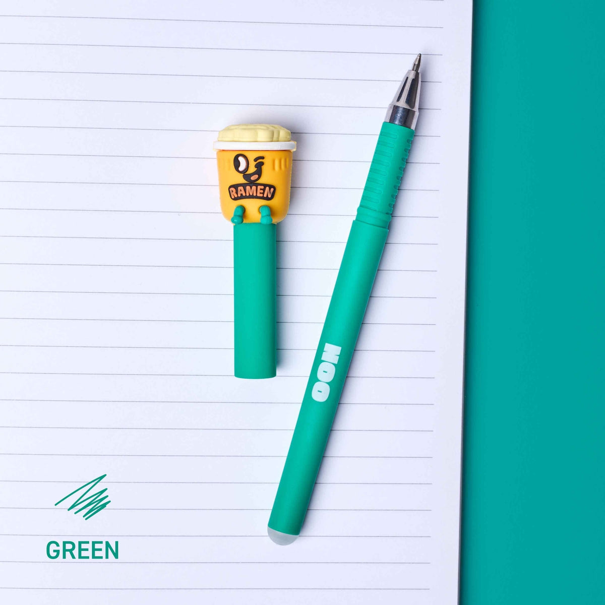 Green pen with a small yellow character on lined paper