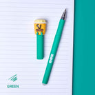 Green pen with a small yellow character on lined paper
