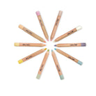Set of makeup pencils with colorful caps arranged in a circle on a white background