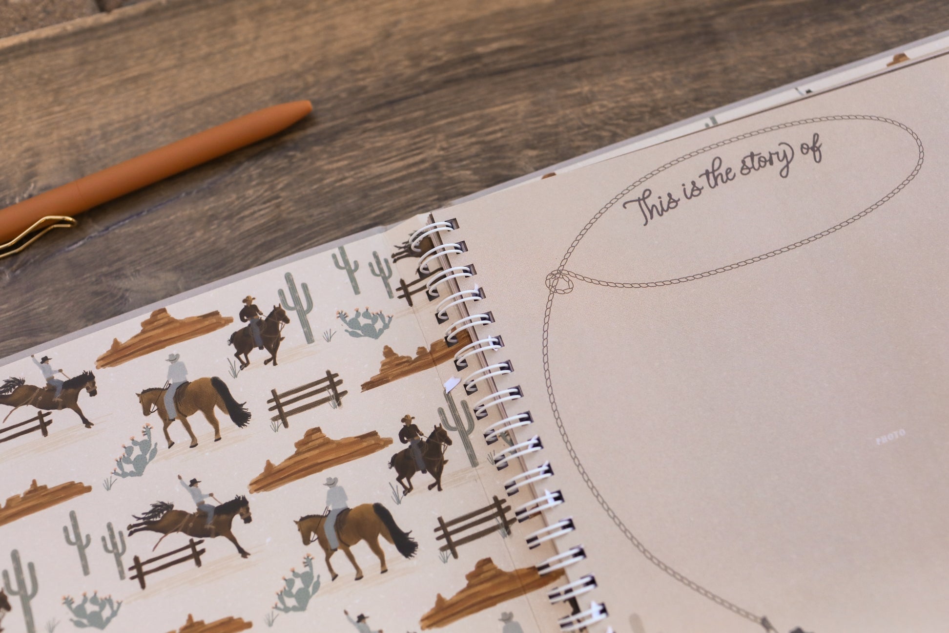 Notebook with cowboy-themed design on a wooden surface