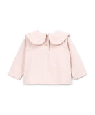A light pink long-sleeve baby top with a large Peter Pan collar and a small gold button at the neckline, shown flat on a white background.
