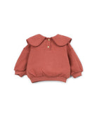 A dusty rose long-sleeve knit top for toddlers, featuring a large, wide scalloped Peter Pan collar and two small decorative buttons at the collar, displayed on a clean white background.