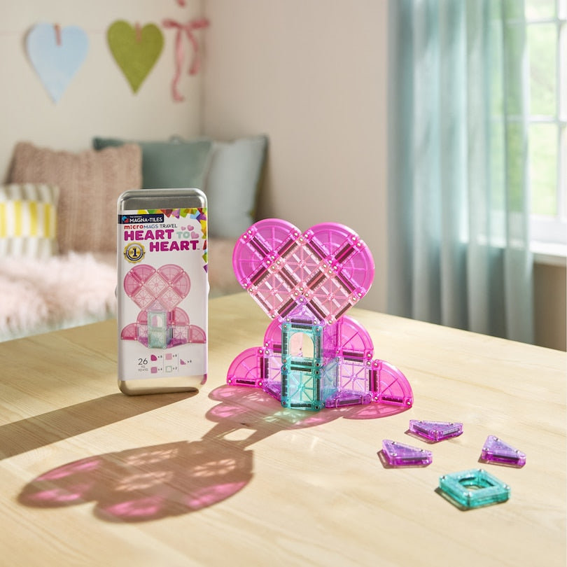 Colorful magnetic building blocks on a table.
