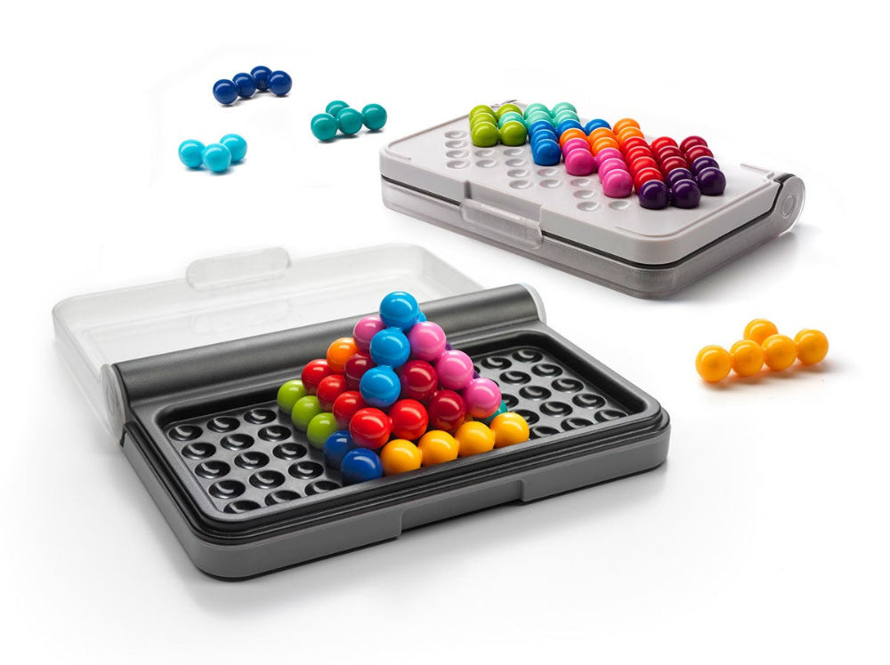 Colorful magnetic building blocks in a clear plastic case on a white background