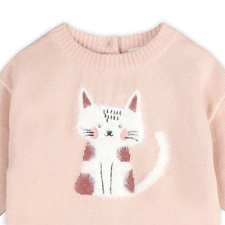 A close-up of a light pink knit sweater featuring a white cat graphic with pink and brown accents on the front.