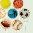 Cupcake toppers with sports-themed designs on a light green background, featuring tennis ball, basketball, soccer ball, football, and baseball.
