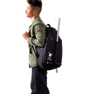 Person wearing a black backpack with a visible brand logo on a white background