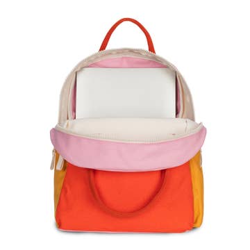 Colorful backpack with pink top section and orange bottom section on a white background