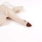 Beige fabric swan toy on a white background