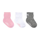 Three pairs of baby socks in pink, white, and gray on a white background