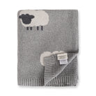 Gray knitted blanket with sheep designs with Viverano label on a white background