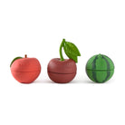Three fruit-shaped containers on a white background
