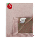 Folded pink baby blanket with a strawberry design and Viverano label on a white background