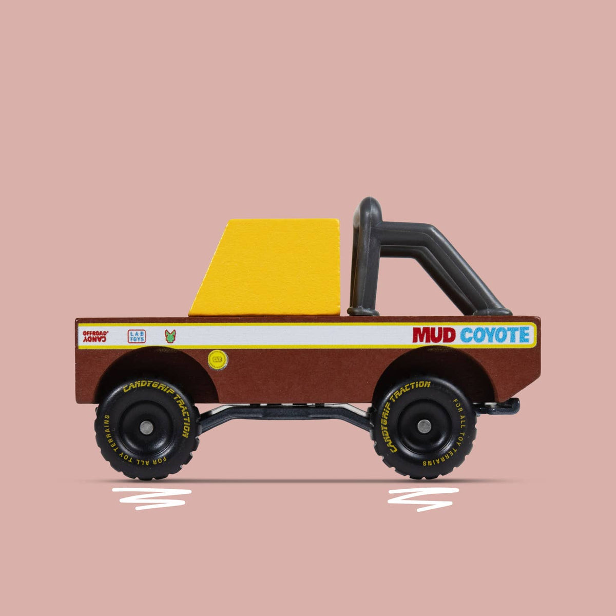 Toy truck with a yellow bed and brown body on a pink background